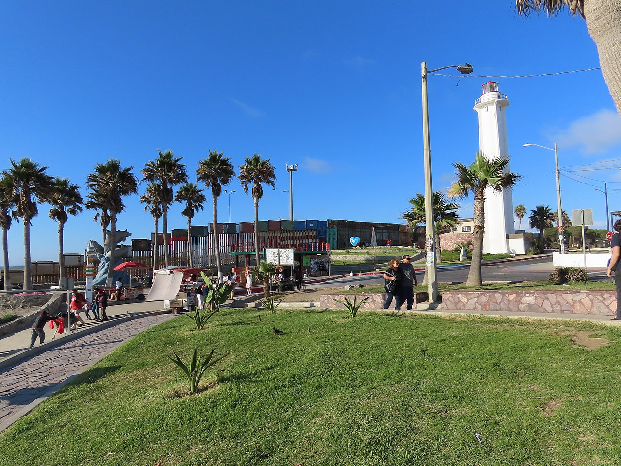 A surveillance tower overlooks the border fence
